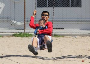 Simon Chan at the park with his son